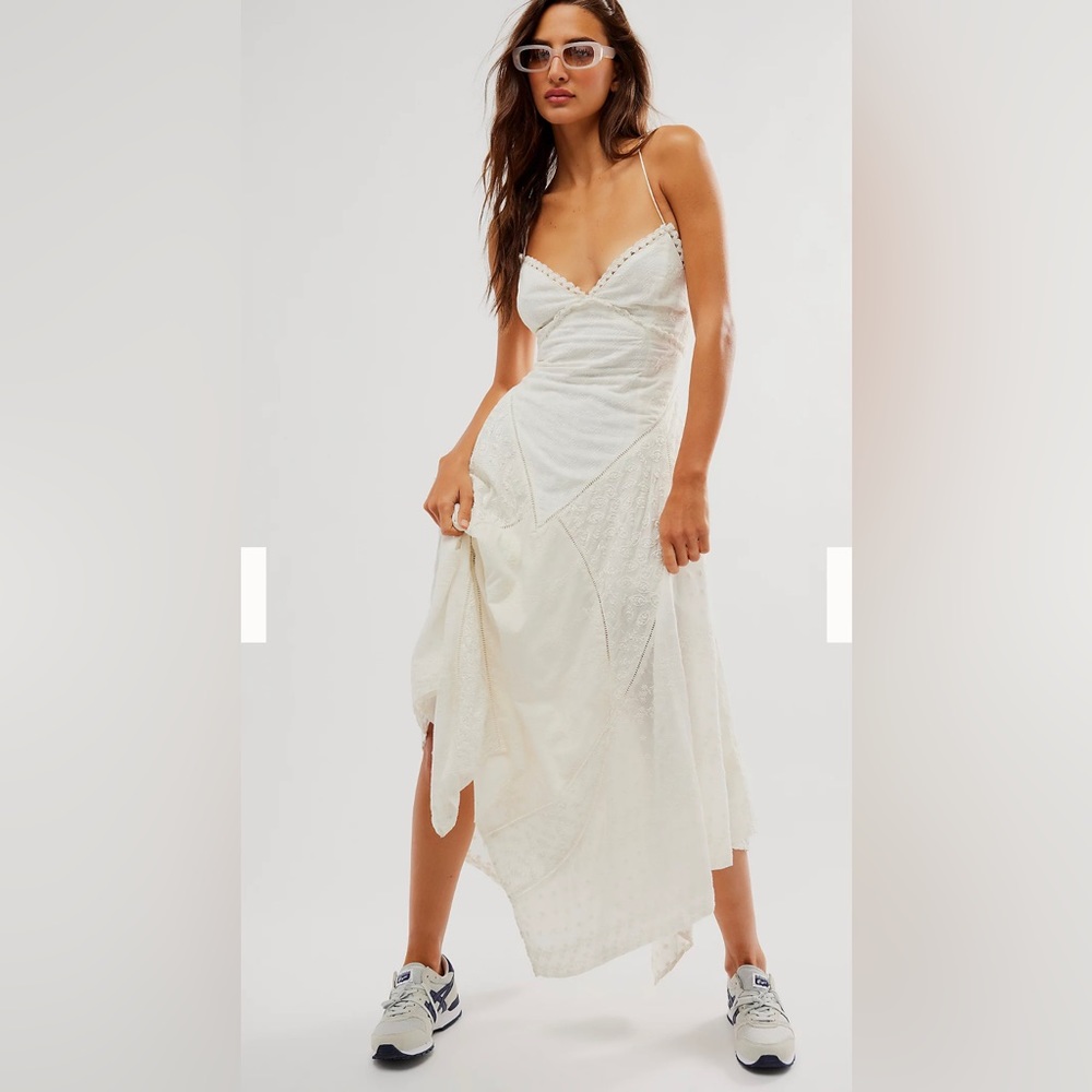 Free people white maxi dress with adjustable tie straps.